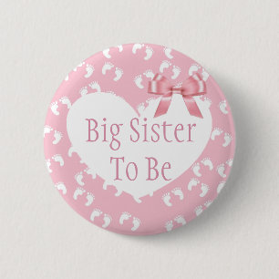 Storasystern som är rosapilbågebaby shower, knapp