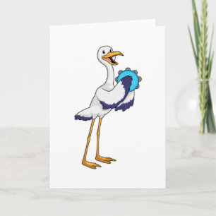 Stork som musiker med tamburin kort