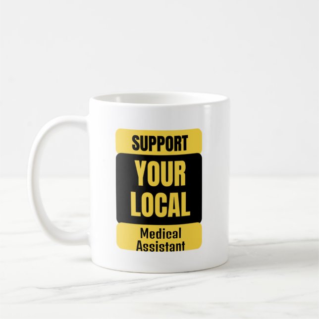 Stötta din lokala medicinska assistent  kaffemugg (Vänster)