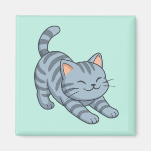 Sträckande grå tabbymkatt grön magnet