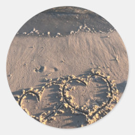 Strand runt klistermärke