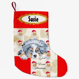 Strumpa för blåttMerle Aussie valp w/Santa