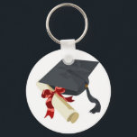 Studentmössa och diplomati nyckelring<br><div class="desc">Svart diplomathatt och diplomatkaval i studenten,  upprullade och säkrade med en röd färgad-band</div>