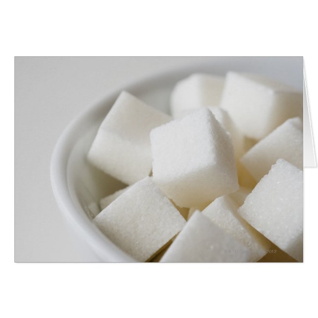 Studio-skott av sockerbitar i skål hälsningskort (Framsidan Horizontal)