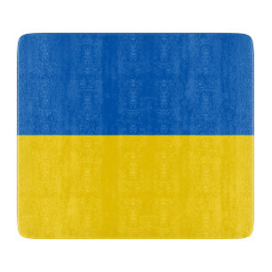 Styckningsbord av litet glas med ukrainska flagga