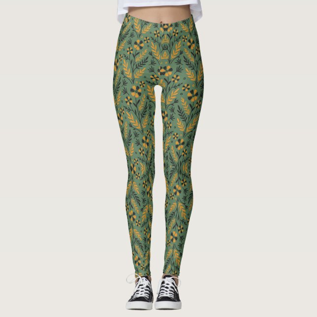 Stylized botanical orange and black floral pattern leggings (Framsida)