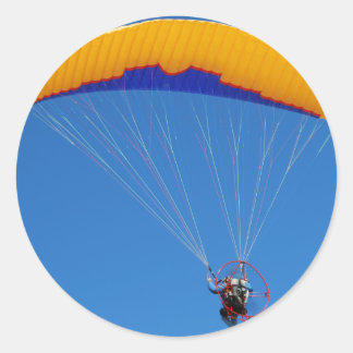 Styrd paraglider runt klistermärke