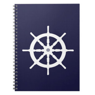 Styrningen rullar på marinblå bakgrund anteckningsbok med spiral