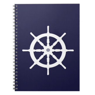 Styrningen rullar på marinblå bakgrund anteckningsbok med spiral