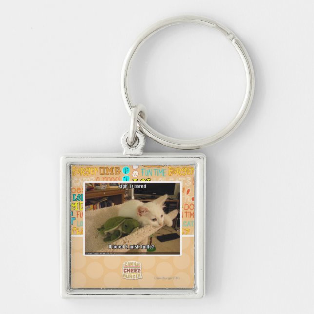 Sucka. Iz borrade Fyrkantig Silverfärgad Nyckelring (Framsidan)