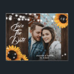 Sunflower Wedding Photo Save The Date Postcard Meddelande Vykort<br><div class="desc">Rustic sunflower wedding photo save the date postcard featuring sunflowers and string lights on a barn wood background.</div>