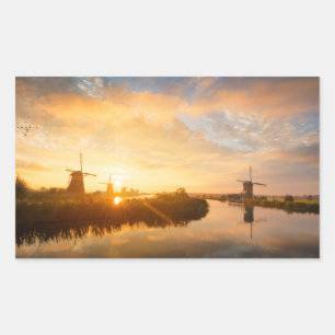 Sunrise över vindkraftverk och en flod i Holland Rektangulärt Klistermärke