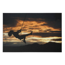 Sunset Silhouette of Girl on Swing