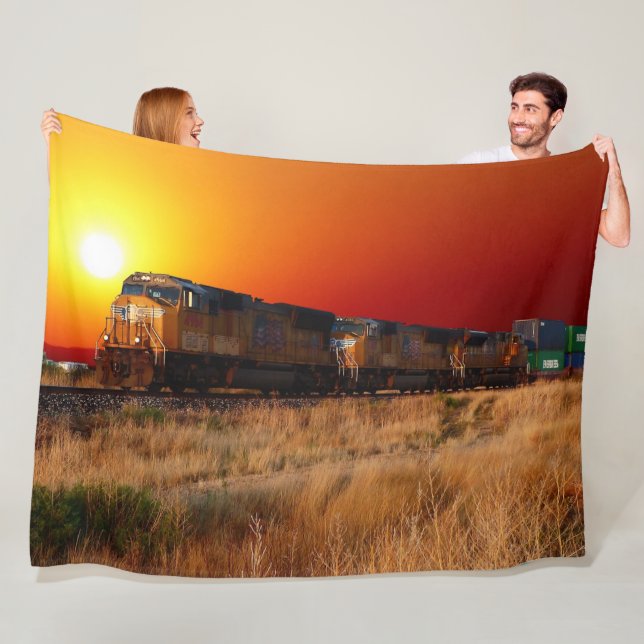 SUNSET TÅG FLEECEFILT (På plats)