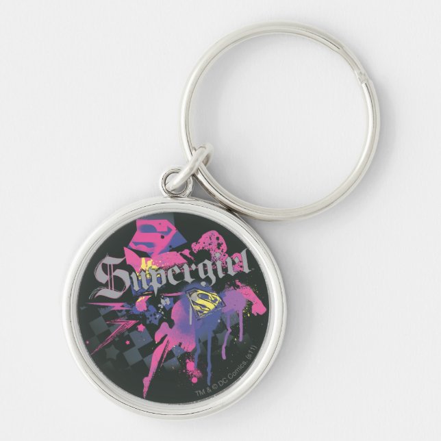 Supergirl Checkered Splatter Rund Silverfärgad Nyckelring (Framsidan)