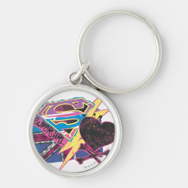 Supergirl Flagga och Crossbone Rund Silverfärgad Nyckelring (Framsidan)