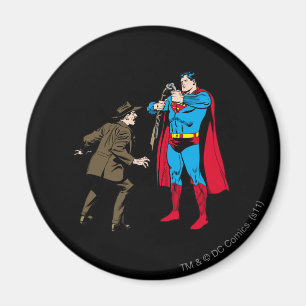 Superman bajsar en pistol magnet