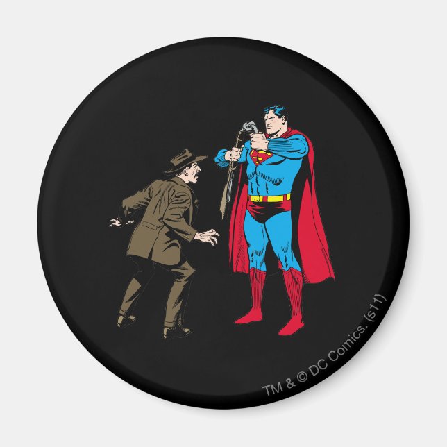Superman böjer en pistol magnet (Framsidan)