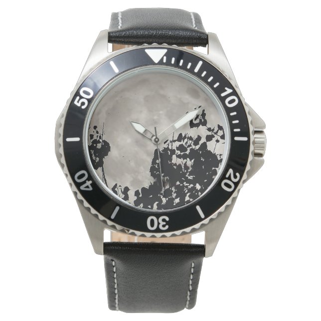 Supermåne bakom svart löv armbandsur (Framsida)