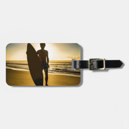 Surfer silhuett under soluppgång bagagebricka