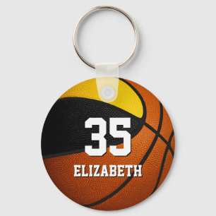Svart basketbolllagets spritgåvor från guld nyckelring