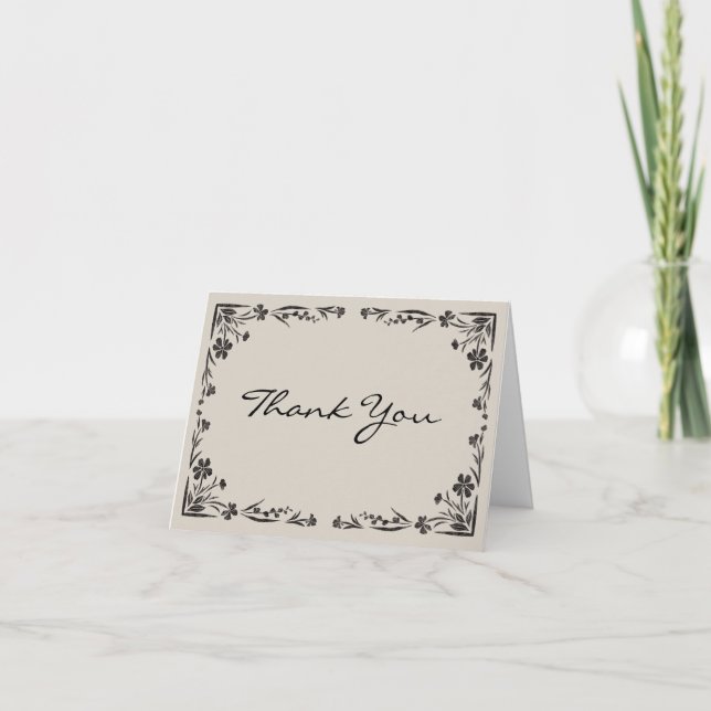 Svart blommig tackkort med maskinskriven text (Framsida)