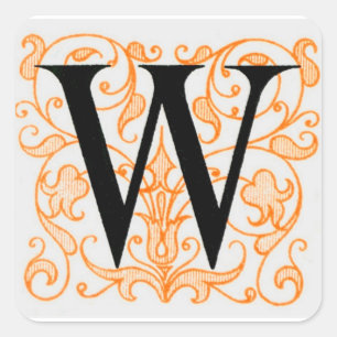 Svart brev "W" på guld - klistermärke