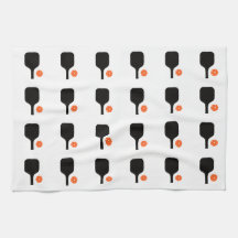 Svart burkpadlar och orange bollar handduva