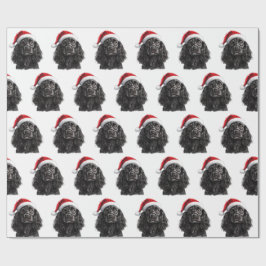 Svart engelsk cocker spaniel hund med tomtehatt presentpapper