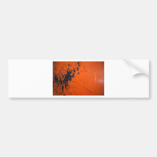 Svart färgstänk på orangen bildekal