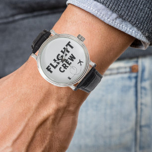 Svart flygbesättning och flygplan med resväder armbandsur