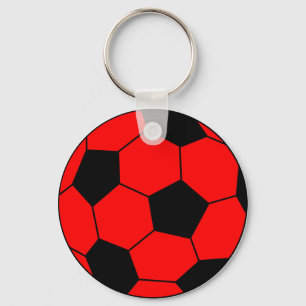 Svart fotbollfotboll som är röd och nyckelring