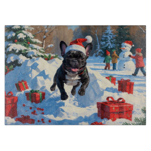 Svart fransk bulldogg julfirande snöscen