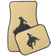 Svart guld- Cowboy som sparkar bakut hästen