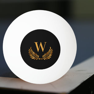 Svart guld-lagerutandningsmonogram pingisboll