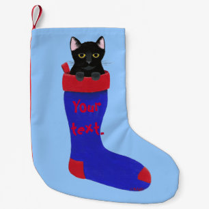 Svart katt i röd och blåttjulstrumpa liten julstrumpa
