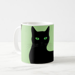 Svart katt med grönt öga kaffemugg