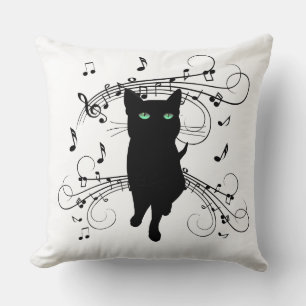 Svart katt omgiven av viskande toner av musik kudde