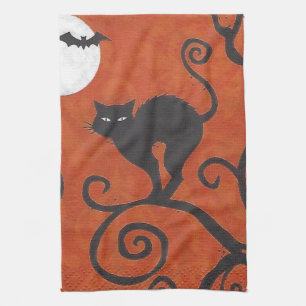 svart katt, orange kökshandduk