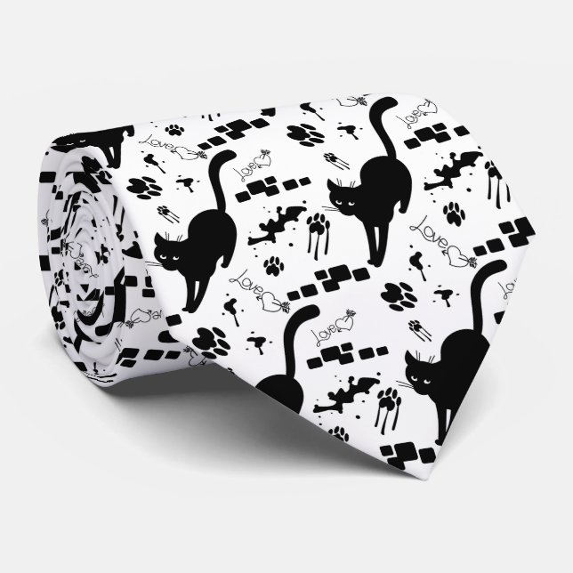 Svart katt på gatan slips (Rullad)