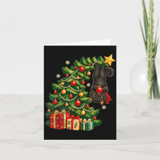 Svart katt som hänger från julgran festlig husdjur kort