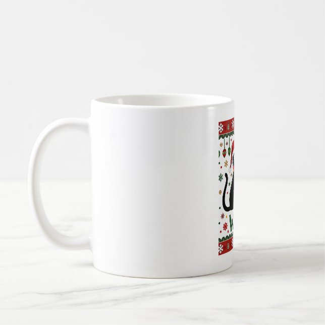 Svart katt som puttar julgran rolig katt Xm Kaffemugg (Vänster)