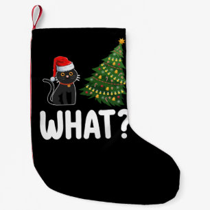 Svart katt som puttar julgran rolig liten julstrumpa