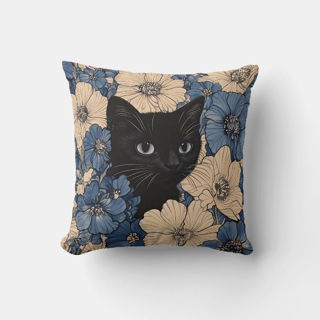 Svart katt som tittar fram genom blåa och krämfärg kudde (Framsida)
