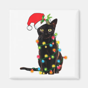 Svart katt tomte trasslad i julbelysning magnet