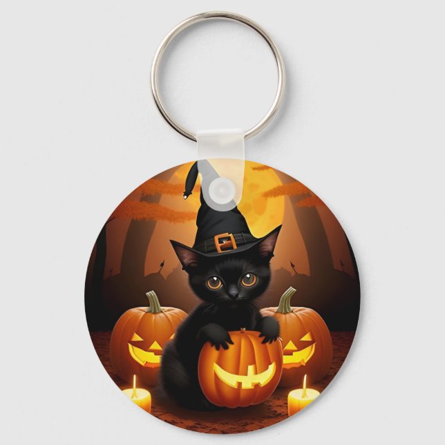 Svart kattunge i häxhatt bland halloweenpumpor nyckelring (Framsida)