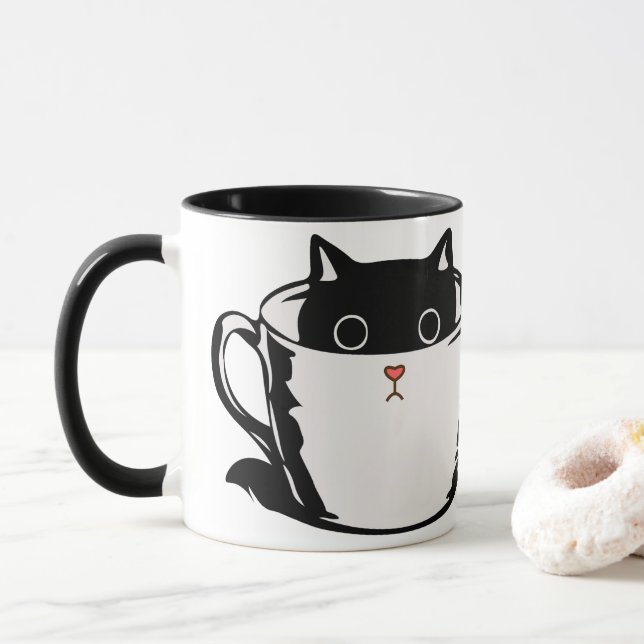 Svart kattunge med röd näsa gömmande i kopp (Med munk)