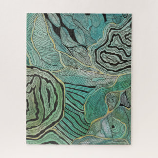 Svart klottrade löv på kricka och guld- pussel