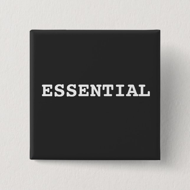 Svart knapp som säger Essential (Framsida)
