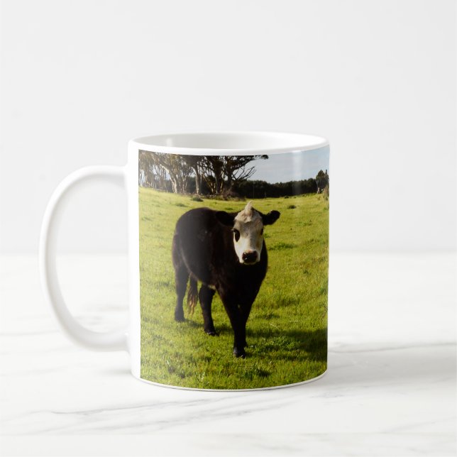 Svart kummel med vit Ansikte och mohawk. Kaffemugg (Vänster)